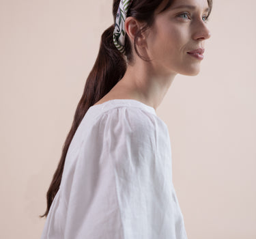 The Koi Carré scarf is a beautiful 100% silk twill square scarf.  Can worn as a headscarf, hair ribbon, on the wrist, or on your bag handle.