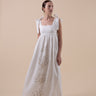 The Lace Coral Dress is composed of 100% European Linen, with beaded applique coral motifs. It offers a comfortable adjustable fit and features delicate applique with glass beads, and real natural baroque pearls on trims.