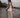 The Nori trousers are an elastic waisted 100% linen pant for a comfortable easy fit, with finishing including real natural pearl and gold plated charms at the end of the belt ties.  Embroidery designed by Fleur Kakasi at the hem. 